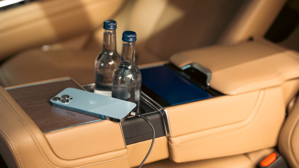 Range Rover LWB interior complimentary water and charger provided by VIP Mayfair