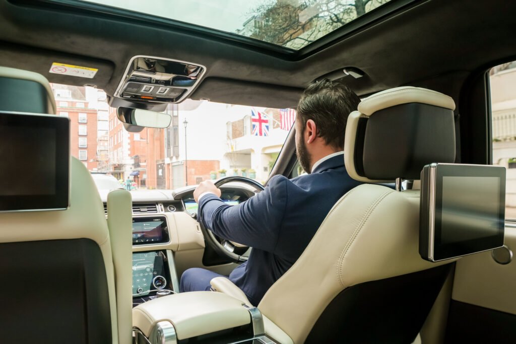 VIP Mayfair chauffeur driving a Range Rover in London for luxury executive car service